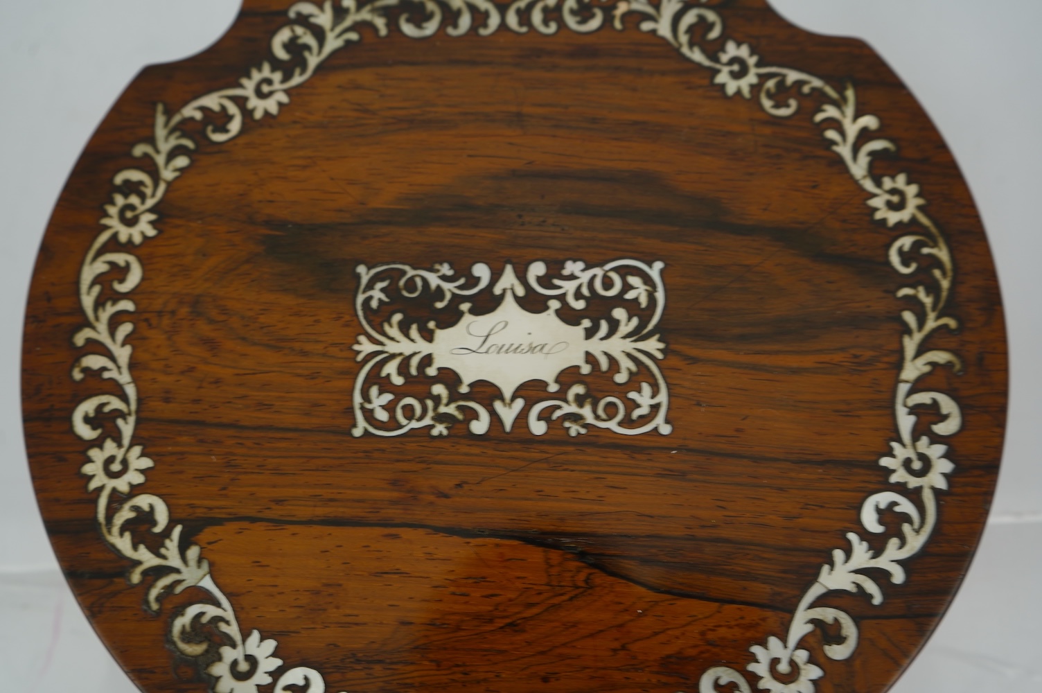 An early Victorian rosewood and mother of pearl inlaid sewing box